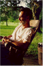 Dinesh Mader rocking on the porch looks out at the natural beauty of Rasayana Cove Ayurvedic Retreat.